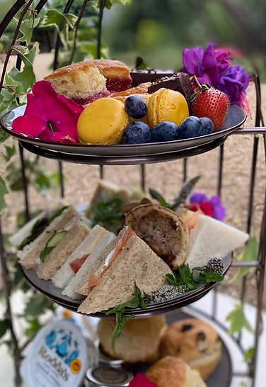 Afternoon tea stand with cakes and scones